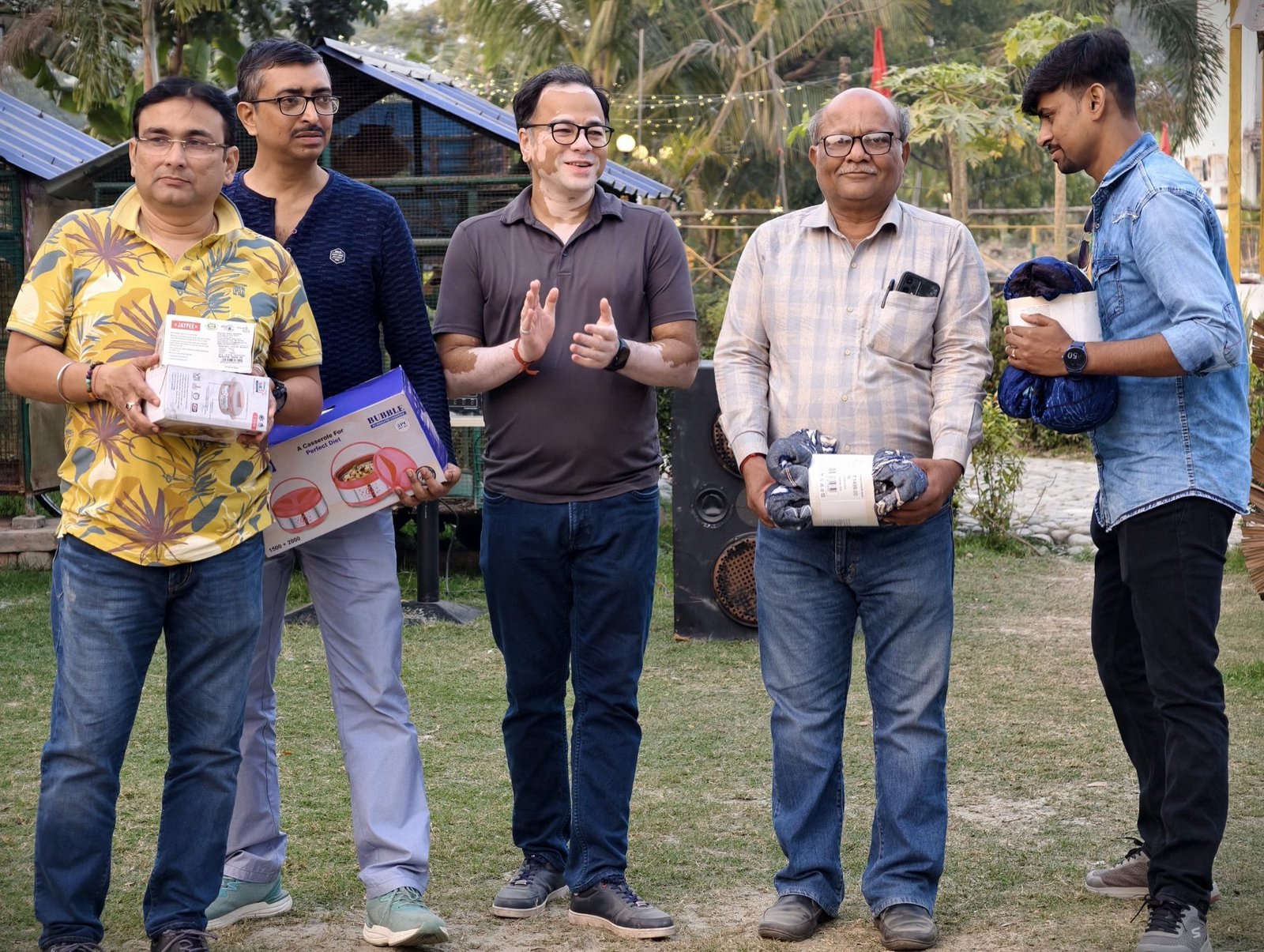Rawatsons colleagues receiving gifts at a team outing